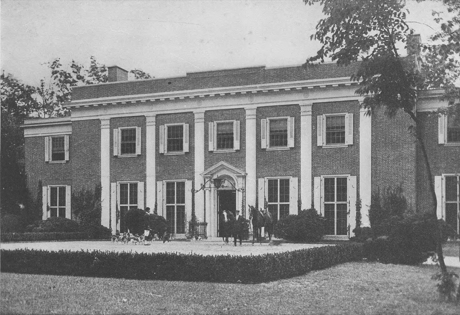 Brick Georgian-style residence with a columned entrance in Jericho, shown in an early photograph