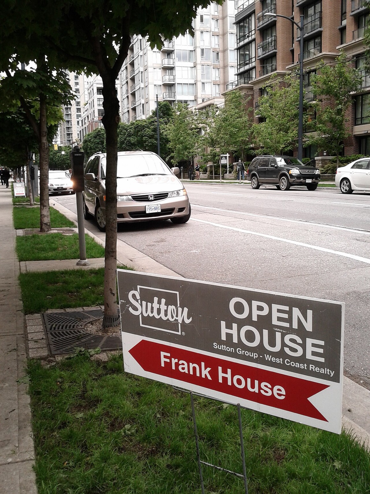 An open house sign in front of a house in Vancouver, British Columbia