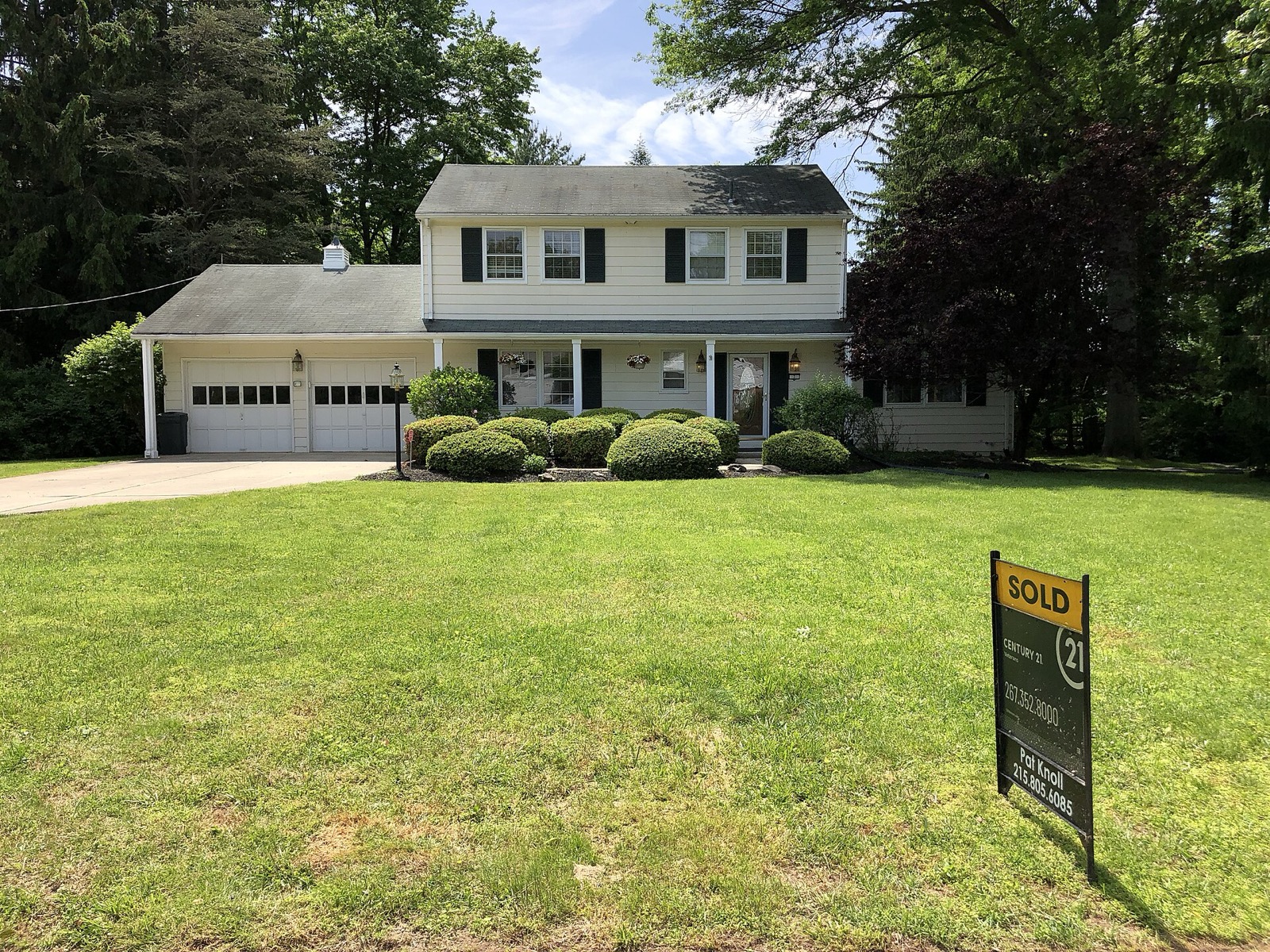 A house with a Sold sign in front on a residential street in New Jersey