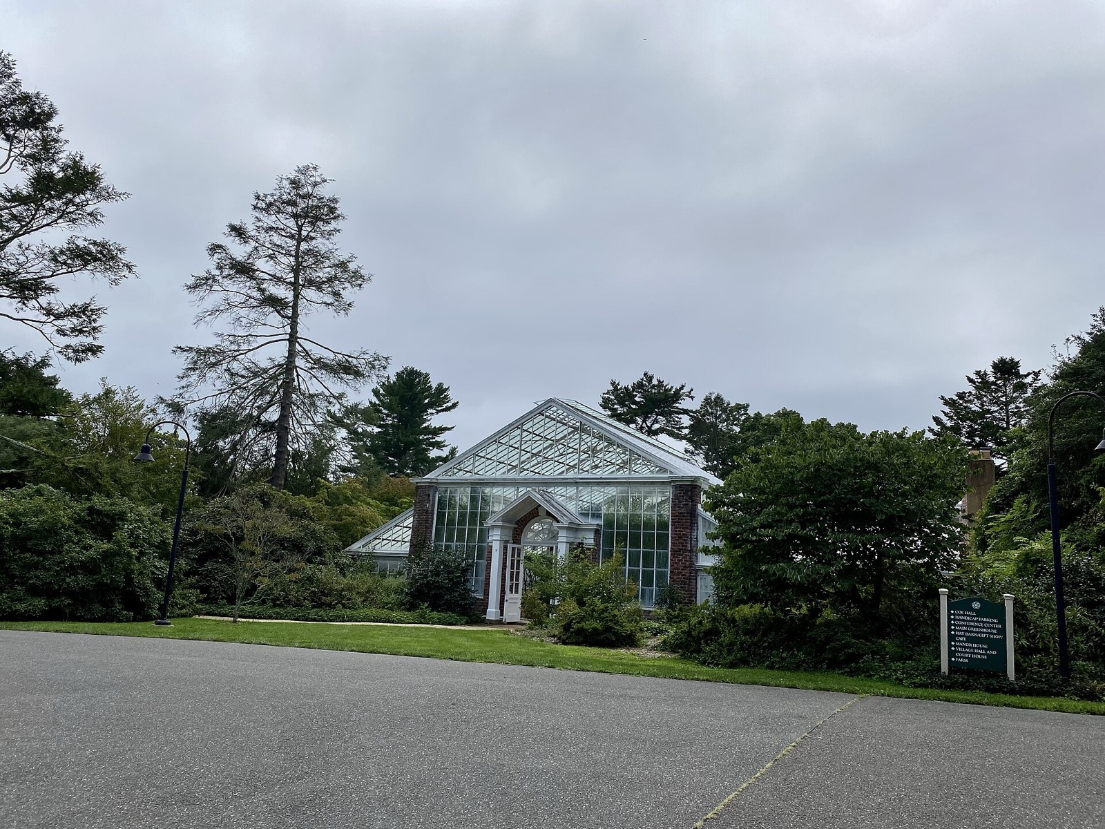 A building at Planting Fields Arboretum in Upper Brookville, with lawns and trees